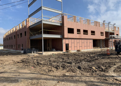 Cambria multi-story building under construction in Waco, with exposed wood framing and trusses.
